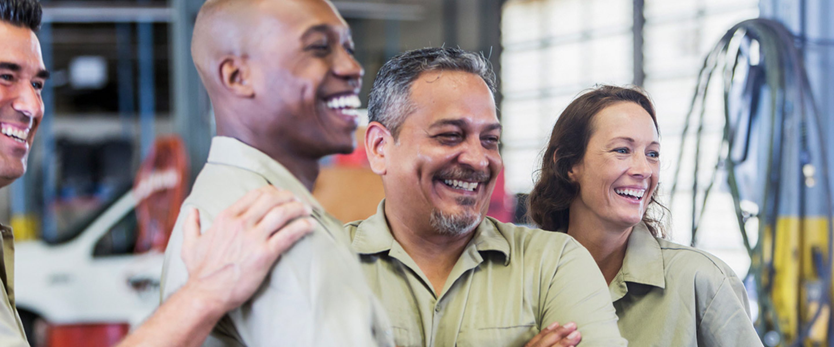 Group of garage workers smiling