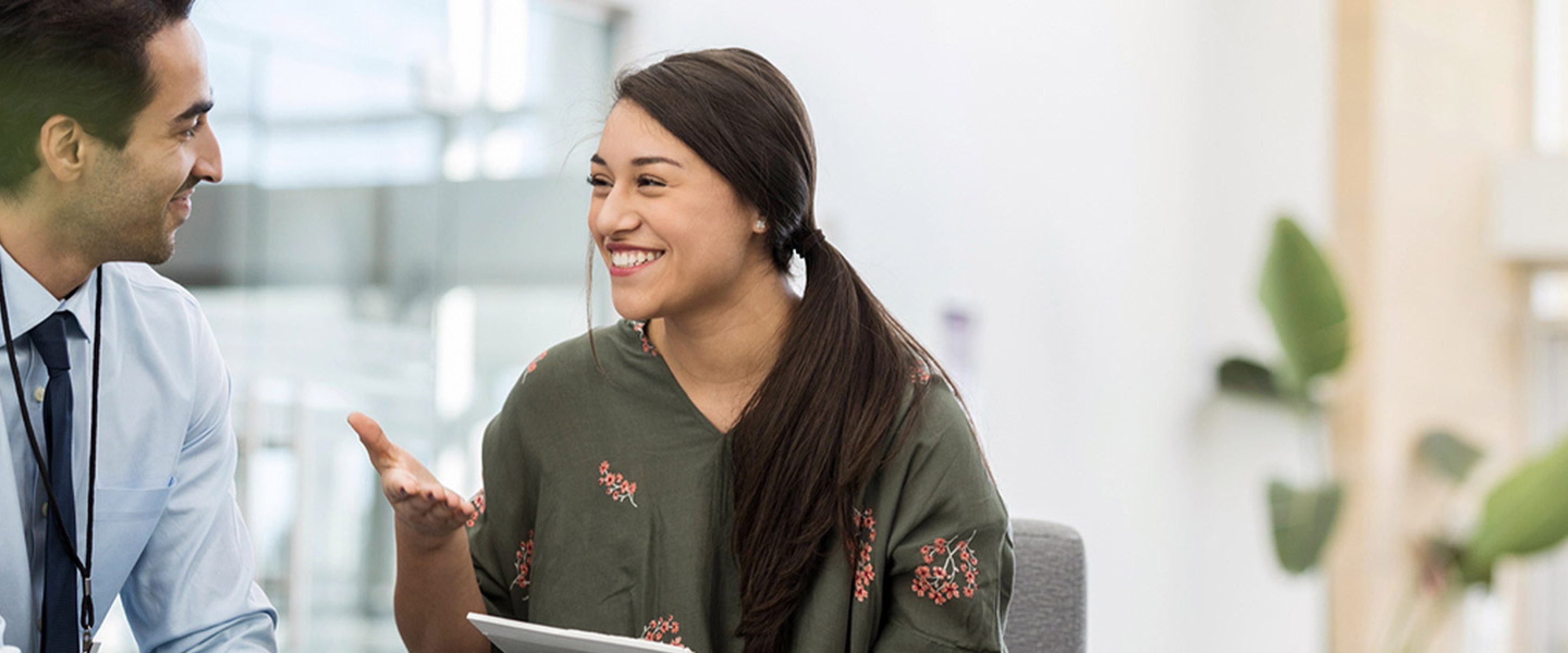 Female university student meets with male counselor